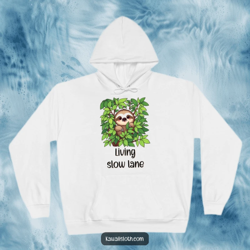 Funny hoodie with a sloth peeking from abundant green foliage and a slight smile, conveying peacefulness.